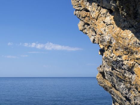 detailed fragment of rock formation with Adriatic sea on background