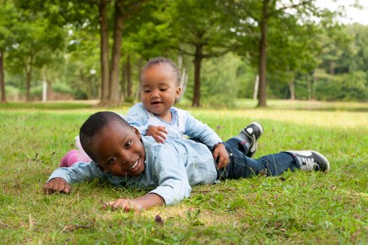 Happy little children are having a nice day in the park