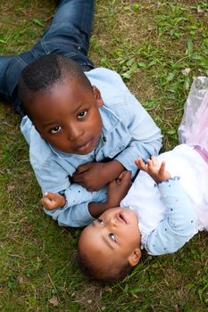 Happy little children are having a nice day in the park