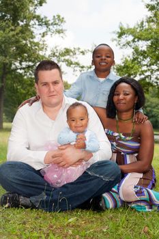 Happy mixed family is having a nice day in the park