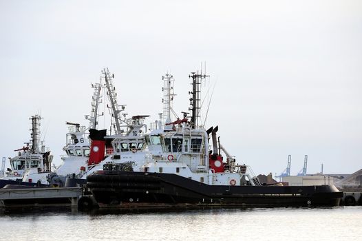 Tug boats with quay for the evening in a creek of Fos on Sea beside Marseille.