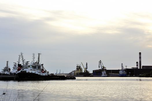 Tug boats with quay for the evening in a creek of Fos on Sea beside Marseille.