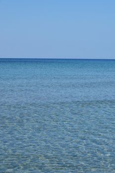 Blue sea with waves and clear blue sky

