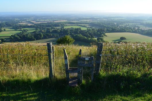 Wooden traditional English stile gate on the South Downs National Park,Sussex.