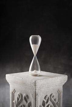 Hourglass on a plaster column.