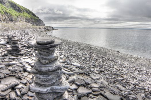 Stack of stones on northern Norway fjord background