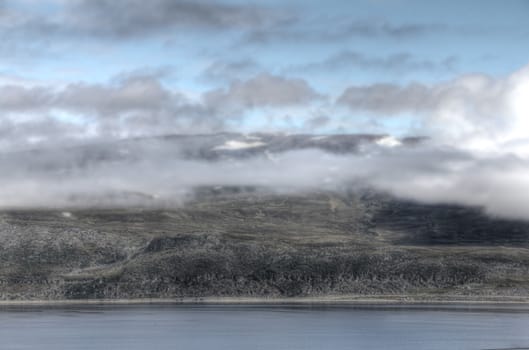 Beautiful view on mountains, clouds and fjord in Norway