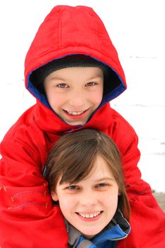 cheerful brother and sister in the winter on the white background