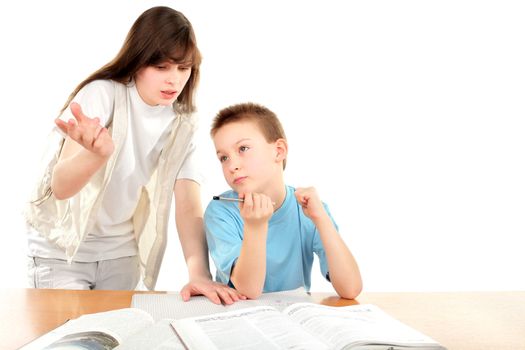 teenage girl and schoolboy on the table with exercise books