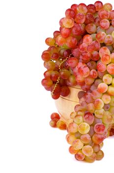 Bunch of Ripe Pink Sultana Grape in Wooden Bowl isolated on white background