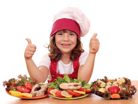 happy little girl cook with seafood and thumbs up