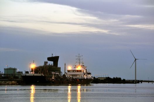 oil terminal of Fos on sea beside Marseille, a cargo liner moored with the quay the night.