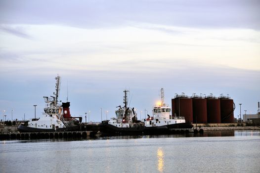 Tug boats with quay for the evening in a creek of Fos on Sea beside Marseille.