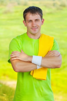 a sportsman with yellow cottton towel