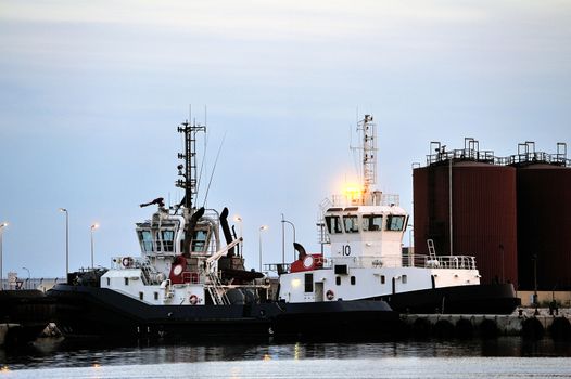 Tug boats with quay for the evening in a creek of Fos on Sea beside Marseille.