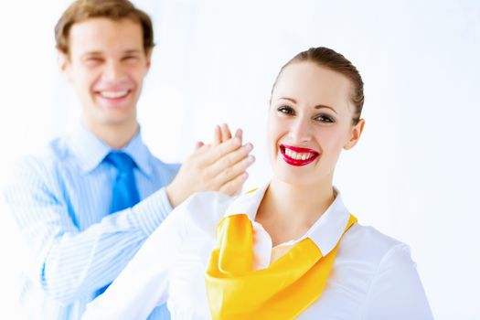 Image of businessman and businesswoman smiling joyfully