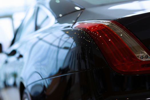 Back view of automobile in sales salon