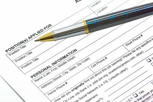 Application form with a pen on it