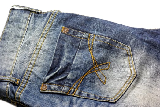 Denim blue jeans back pocket details, on white