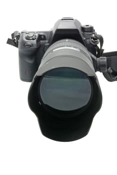 Modern DSLR camera with zoom lens attached on white