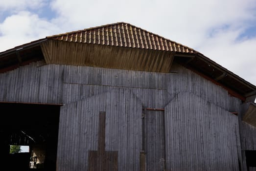  Old vintage barn in a farm agriculture background image             