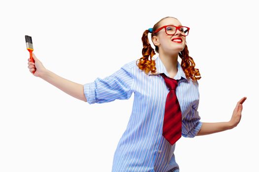 Image of funny teenager girl holding paintbrush