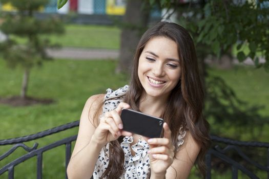 Young woman reading a message on the phone