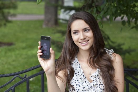 Young woman reading a message on the phone