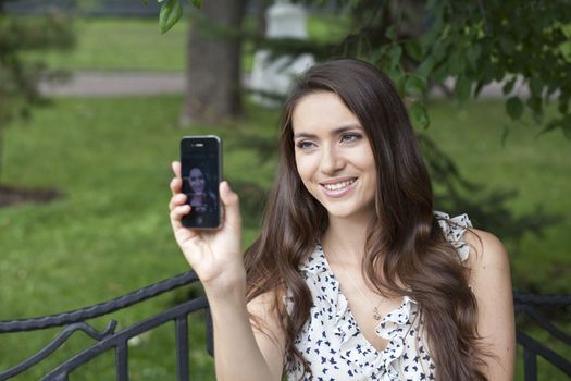 Young woman reading a message on the phone