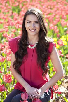 Beautiful young woman with tulips