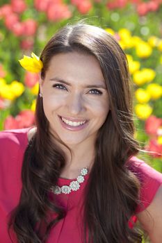 Beautiful young woman with tulips