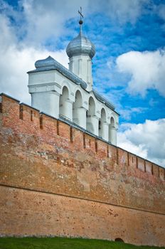 Novgorod Kremlin wall with church belfry above it.