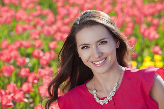 Beautiful young woman with tulips