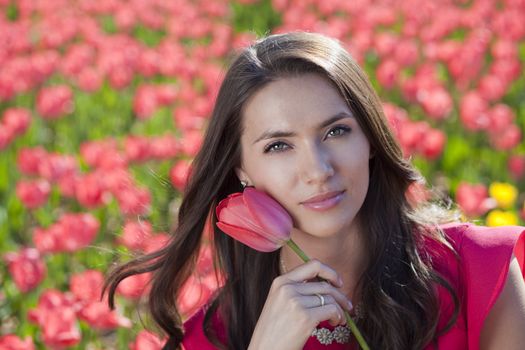 Beautiful young woman with tulips