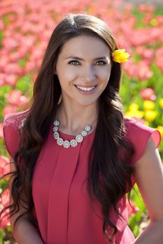 Beautiful young woman with tulips