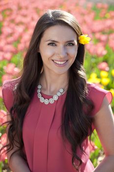 Beautiful young woman with tulips