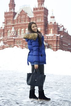 A young woman walking on the Red Square in Moscow
