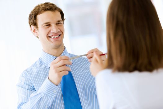 Image of young handsome confident businessman in suit