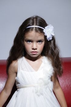 close up portrait of young beautiful little girl with dark hair