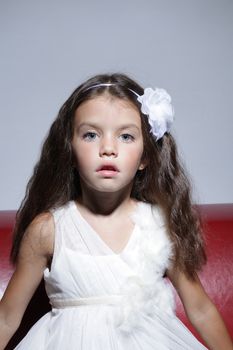 close up portrait of young beautiful little girl with dark hair