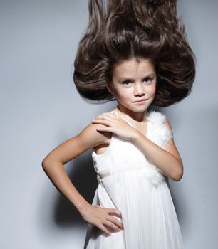 close up portrait of young beautiful little girl with dark hair