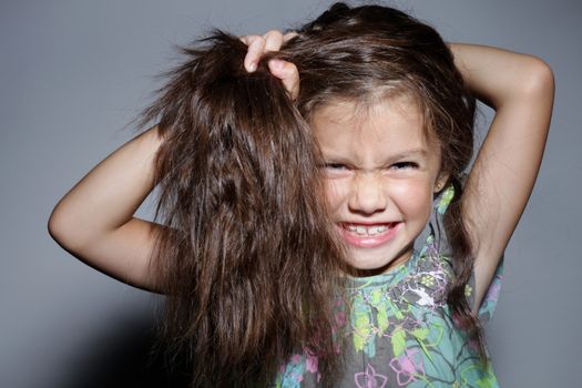 close up portrait of young beautiful little girl with dark hair