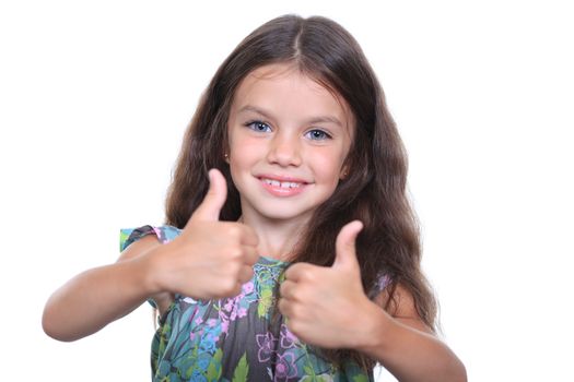 Beautiful little girl shows finger as sign that everything is fine