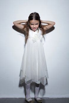 full-length portrait of a little girl in the studio