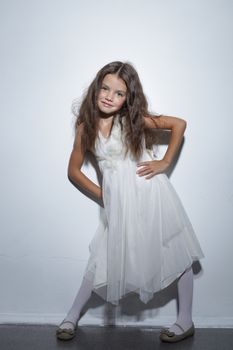 full-length portrait of a little girl in the studio