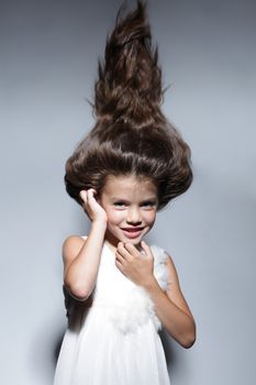 close up portrait of young beautiful little girl with dark hair