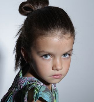 close up portrait of young beautiful little girl with dark hair