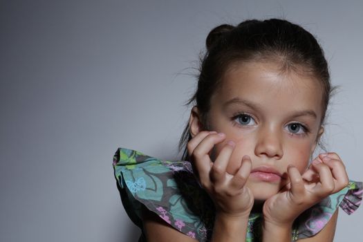 close up portrait of young beautiful little girl with dark hair