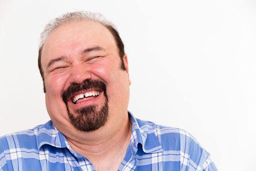 Close-up horizontal portrait of a cheerful middle-aged Caucasian man laughing loud, isolated on white background