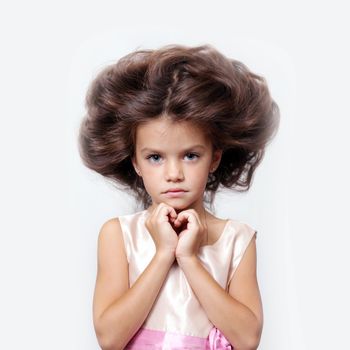 portrait of little girl with extravagant hair on his head